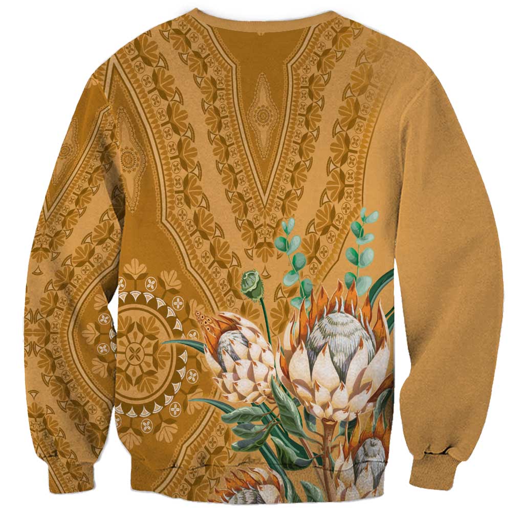 Gold crewneck sweatshirt with back dashiki motif and centered flower-and-leaf artwork