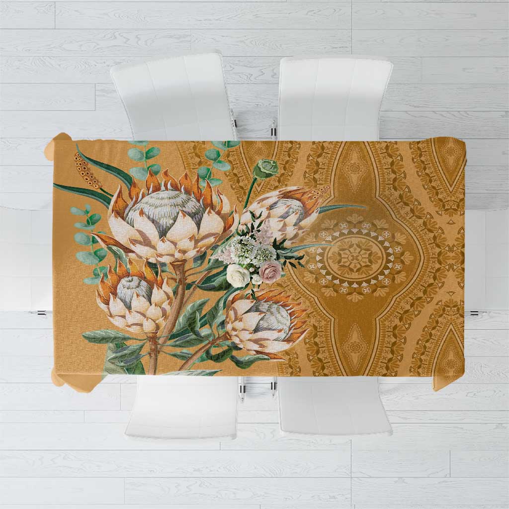 Gold tablecloth top view with large floral-and-leaf motif