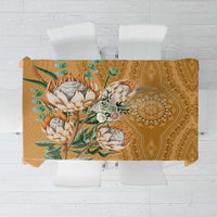 Gold tablecloth top view with large floral-and-leaf motif