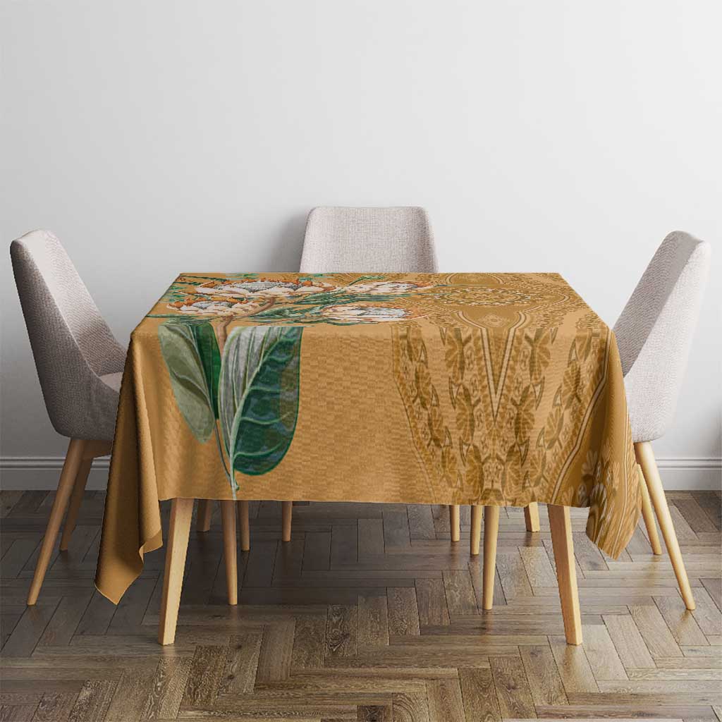 Gold patterned tablecloth with leaf motif and decorative medallion