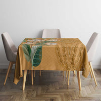 Gold patterned tablecloth with leaf motif and decorative medallion