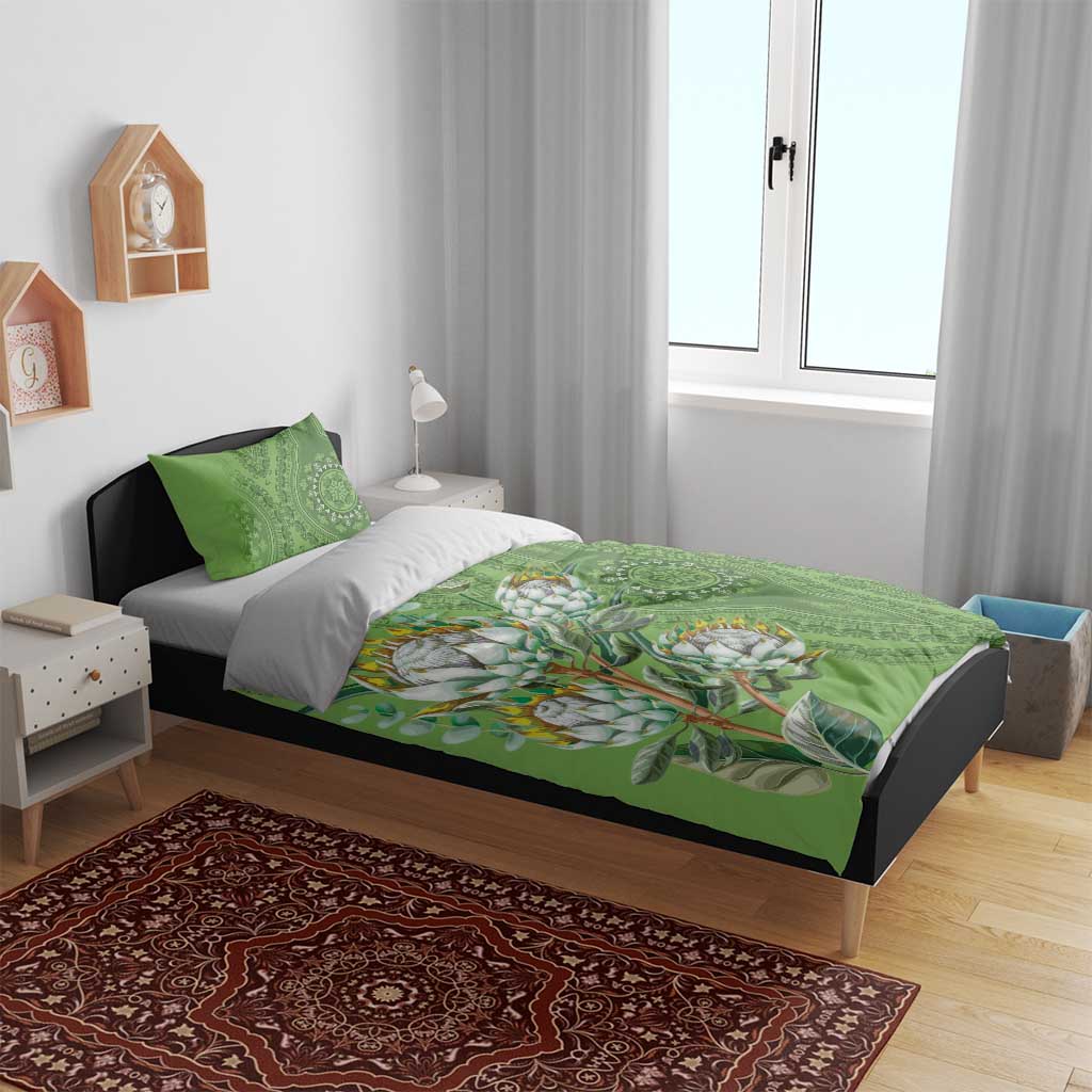 Green bedding set with protea bouquet artwork and ornamental heritage patterns