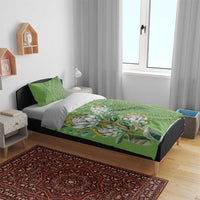 Green bedding set with protea bouquet artwork and ornamental heritage patterns