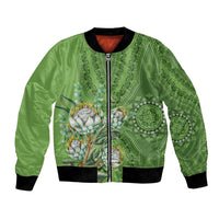 Green bomber jacket with front zipper, ribbed cuffs, and protea motif center
