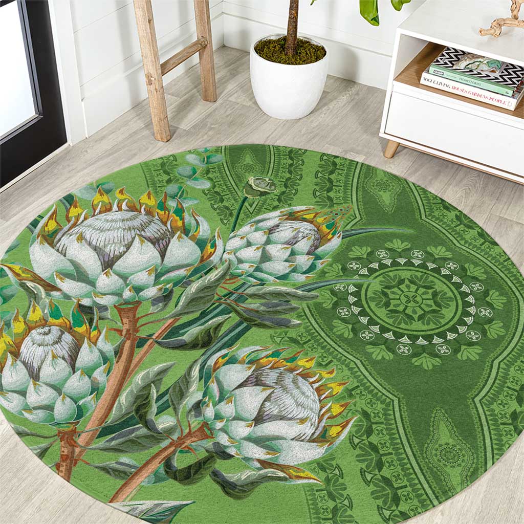 Green round carpet with ornate mandala pattern and colorful bird-and-flower motif