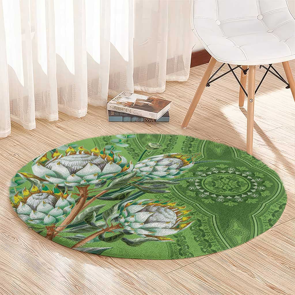 Green round carpet showing bird branch illustration and detailed mandala medallion