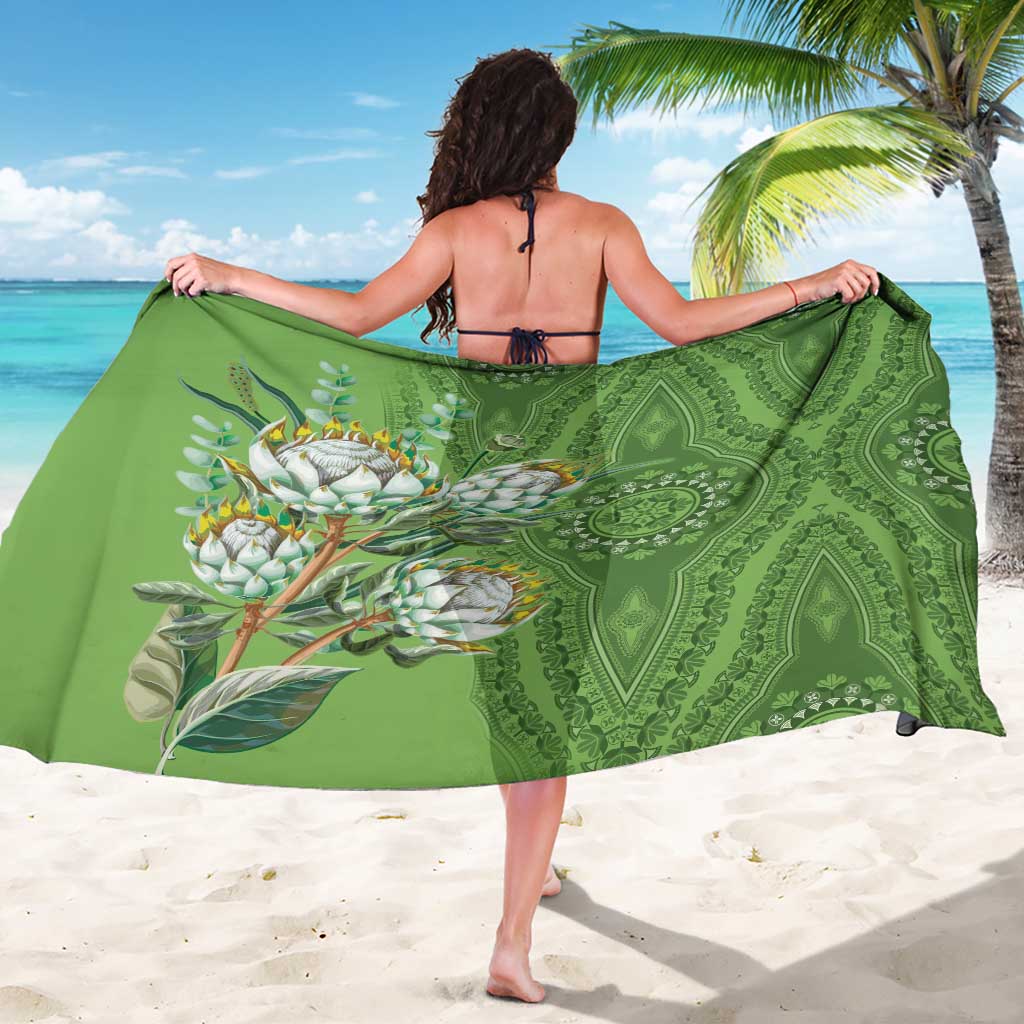 Green dashiki-motif sarong with protea floral print and ornate patterns, shown from back