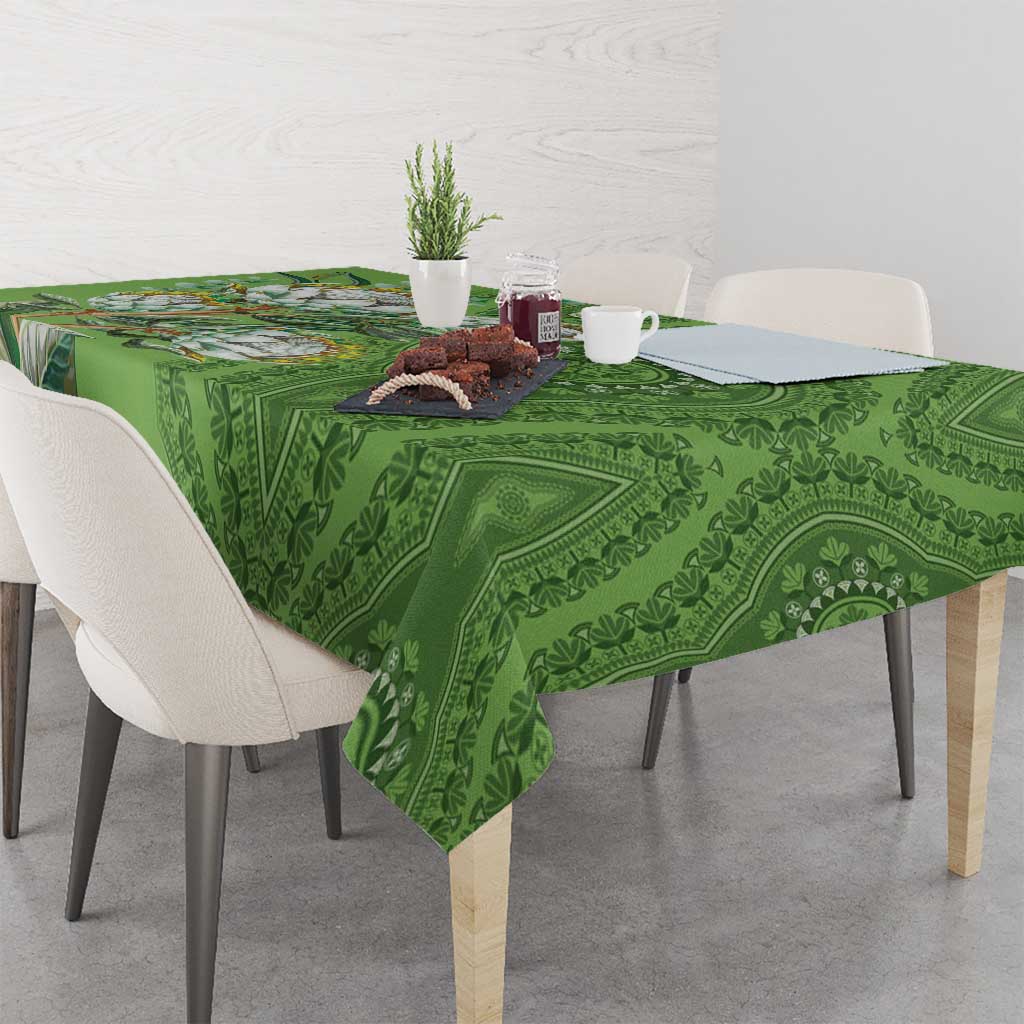Green dashiki motif tablecloth with ornate medallion pattern across tabletop