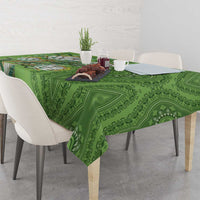 Green dashiki motif tablecloth with ornate medallion pattern across tabletop