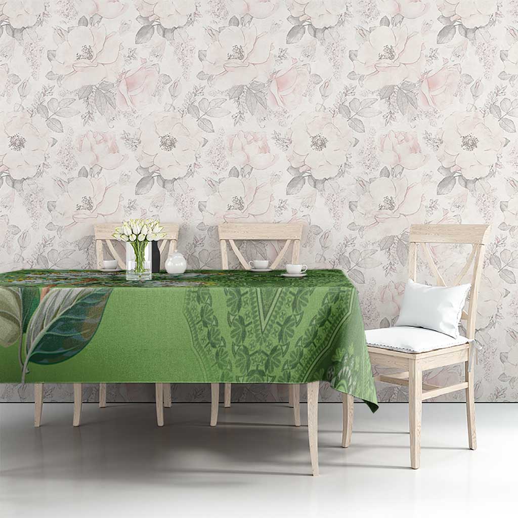 Green dashiki motif tablecloth with ornate leaf and medallion pattern on table