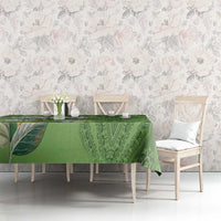 Green dashiki motif tablecloth with ornate leaf and medallion pattern on table