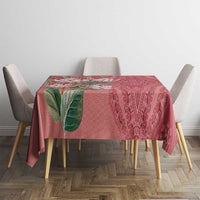 Peach dashiki motif tablecloth on dining table with protea floral and paisley print