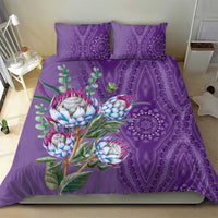 Violet bedding set featuring protea flowers over a purple dashiki medallion pattern, 2 pillowcases