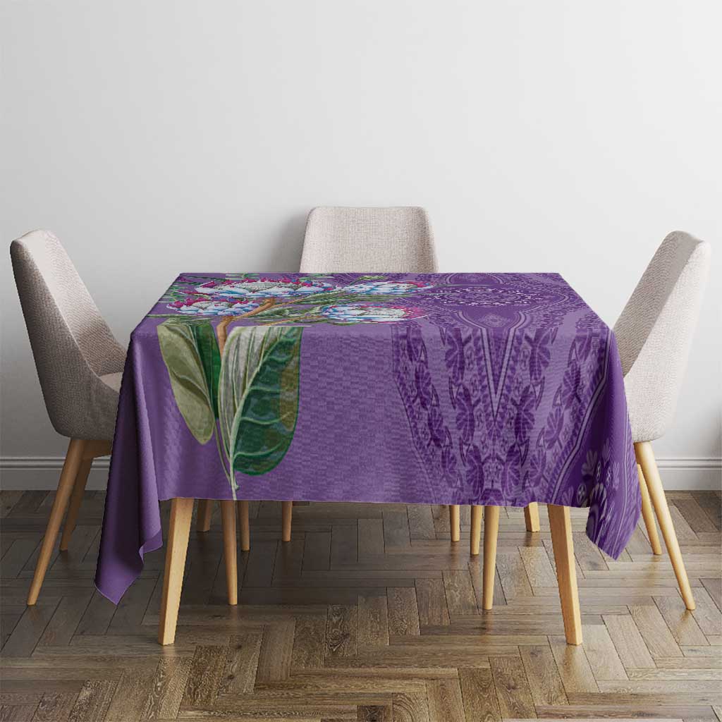 Violet dashiki motif tablecloth draped over dining table with floral and paisley design