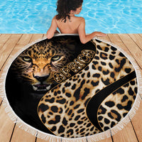 Round leopard-print beach blanket featuring a lion face and black curved graphic, with fringe