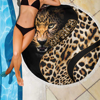 Round leopard-print beach blanket with lion face graphic, black swirls, and white fringe border