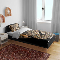 Black bedding set with leopard-print tiger graphic and gold script, plus two pillow shams
