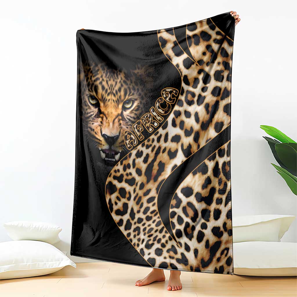 Black leopard-pattern blanket featuring large cat face and gold script