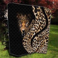 Black quilt with leopard face and tan-and-brown spotted pattern, diamond-quilted texture