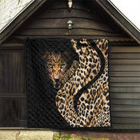 Black quilt blanket with leopard face and tan-and-brown spotted design, displayed on porch wall