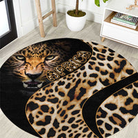 Round leopard-print carpet with cat face, tan spots, and black border trim.