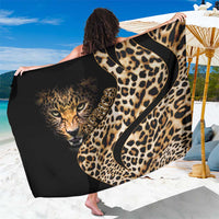 Leopard-print sarong fabric with black-and-gold cat face graphic, wide drape