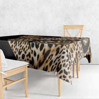 African leopard skin pattern tablecloth over rectangular table, black and tan leopard print.