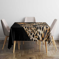 African leopard skin pattern tablecloth draped over square dining table, black and tan.