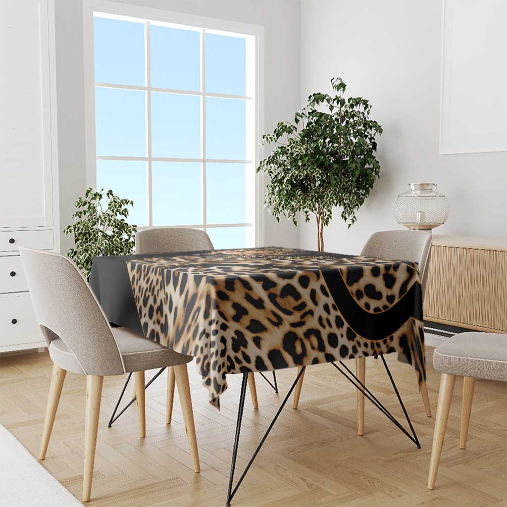 African leopard skin pattern tablecloth on dining table, black and tan leopard print.