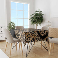African leopard skin pattern tablecloth on dining table, black and tan leopard print.