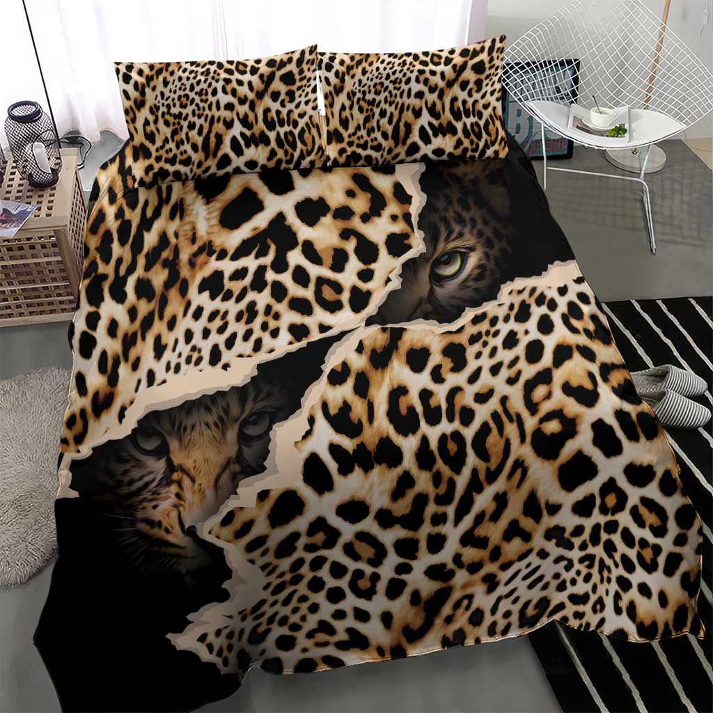 Black leopard-print bedding set with cat faces and bold animal spots on duvet and pillows