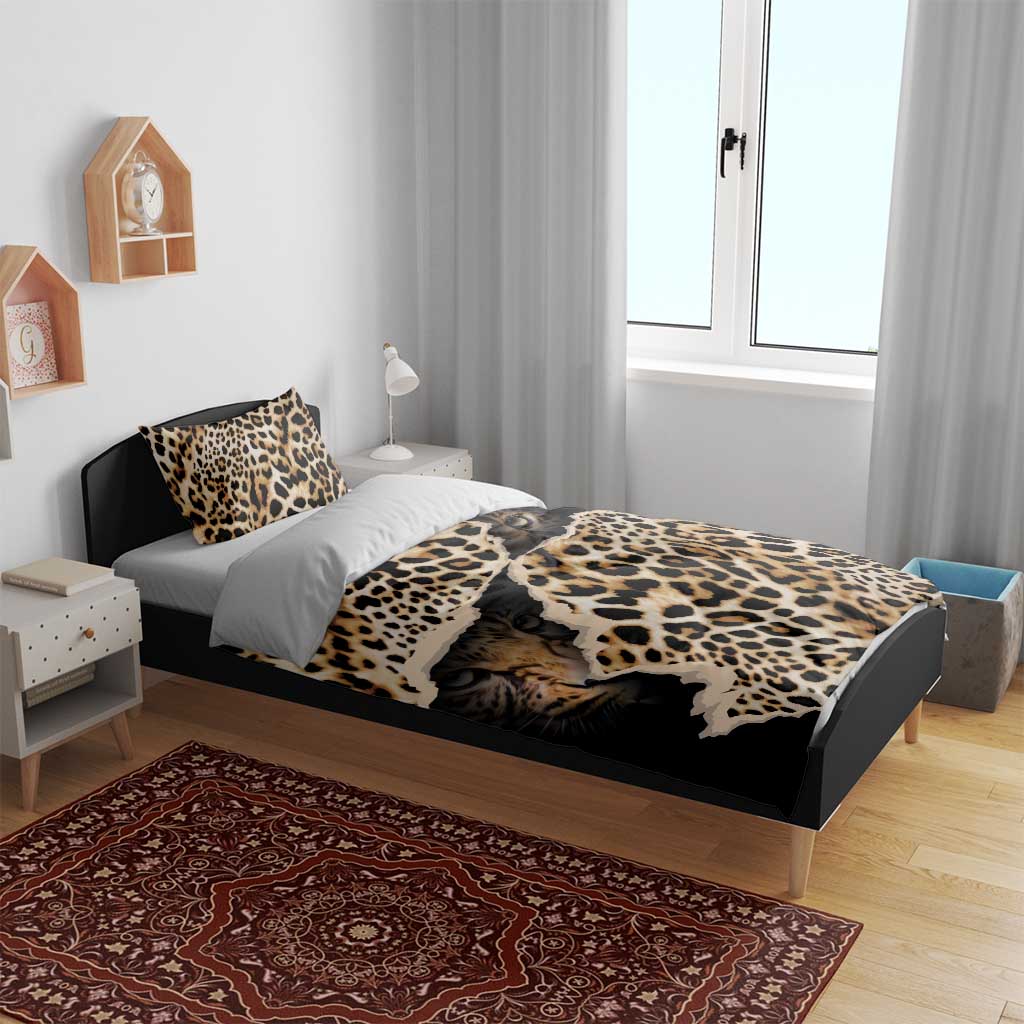 Black leopard-print bedding set on bed with duvet, top pillowcases, and side pillows