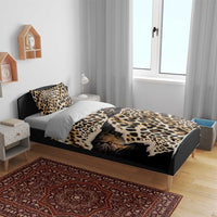 Black leopard-print bedding set on bed with duvet, top pillowcases, and side pillows