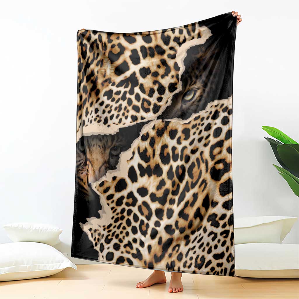 Black and tan leopard-print blanket with animal-face graphic, standing upright
