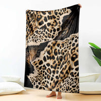 Black and tan leopard-print blanket with animal-face graphic, standing upright