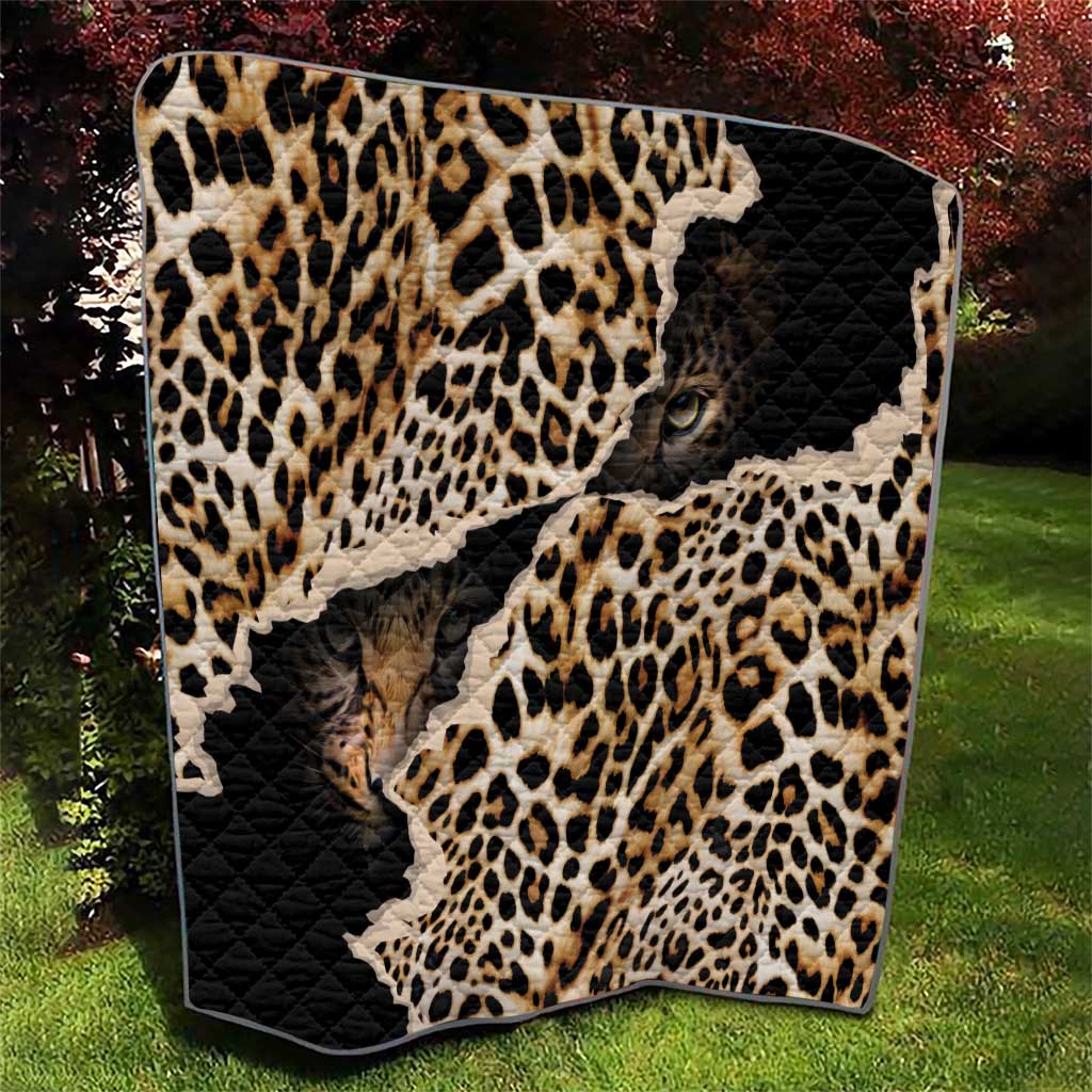 African leopard-skin pattern quilt with black quilted panel and leopard print animal face