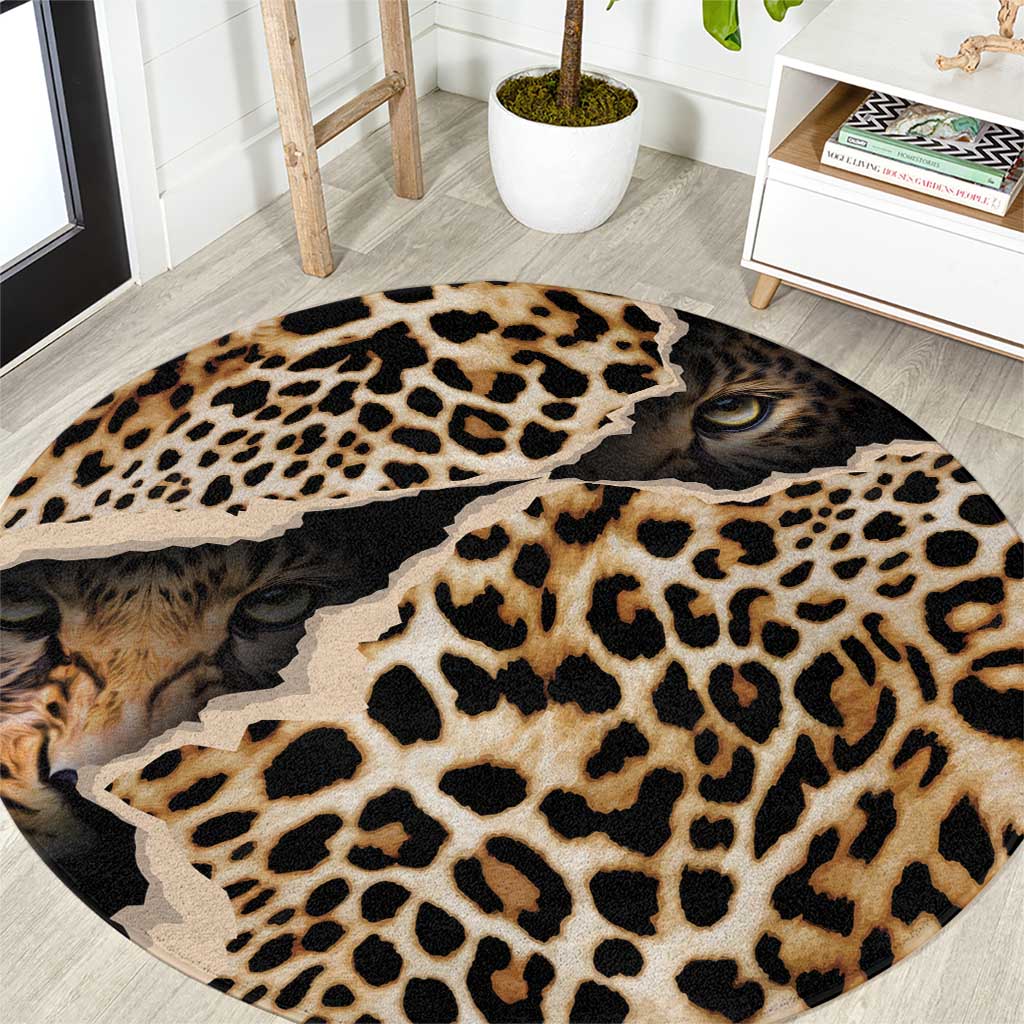 Round leopard print rug with cat face eyes and black-and-tan rosette pattern