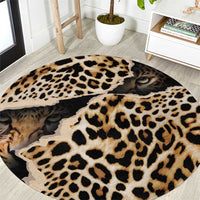 Round leopard print rug with cat face eyes and black-and-tan rosette pattern