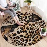 Round leopard print carpet with cat face eyes, black and tan spots, shown on floor