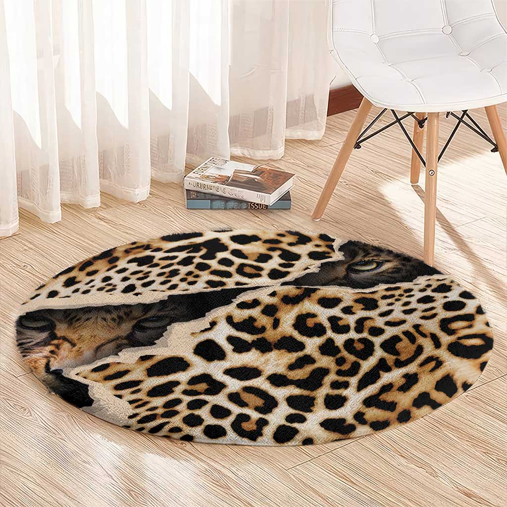 Round leopard print carpet with large cat-eye graphic, black and tan spot pattern