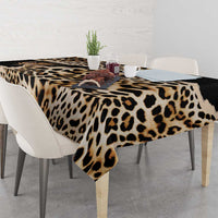 Leopard-print tablecloth on dining table with hanging corner, black and tan