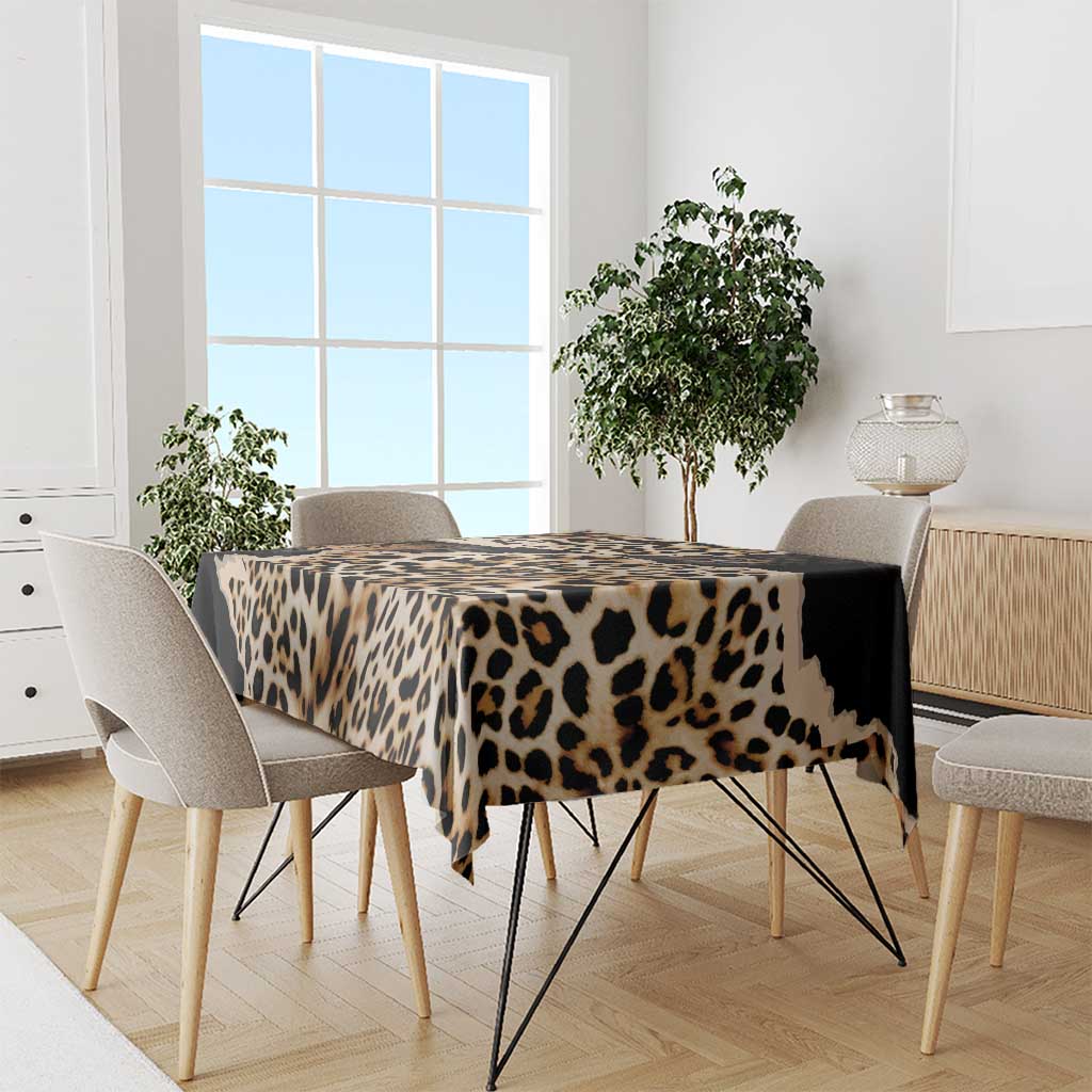 Leopard-print tablecloth with tan spots and black band across table