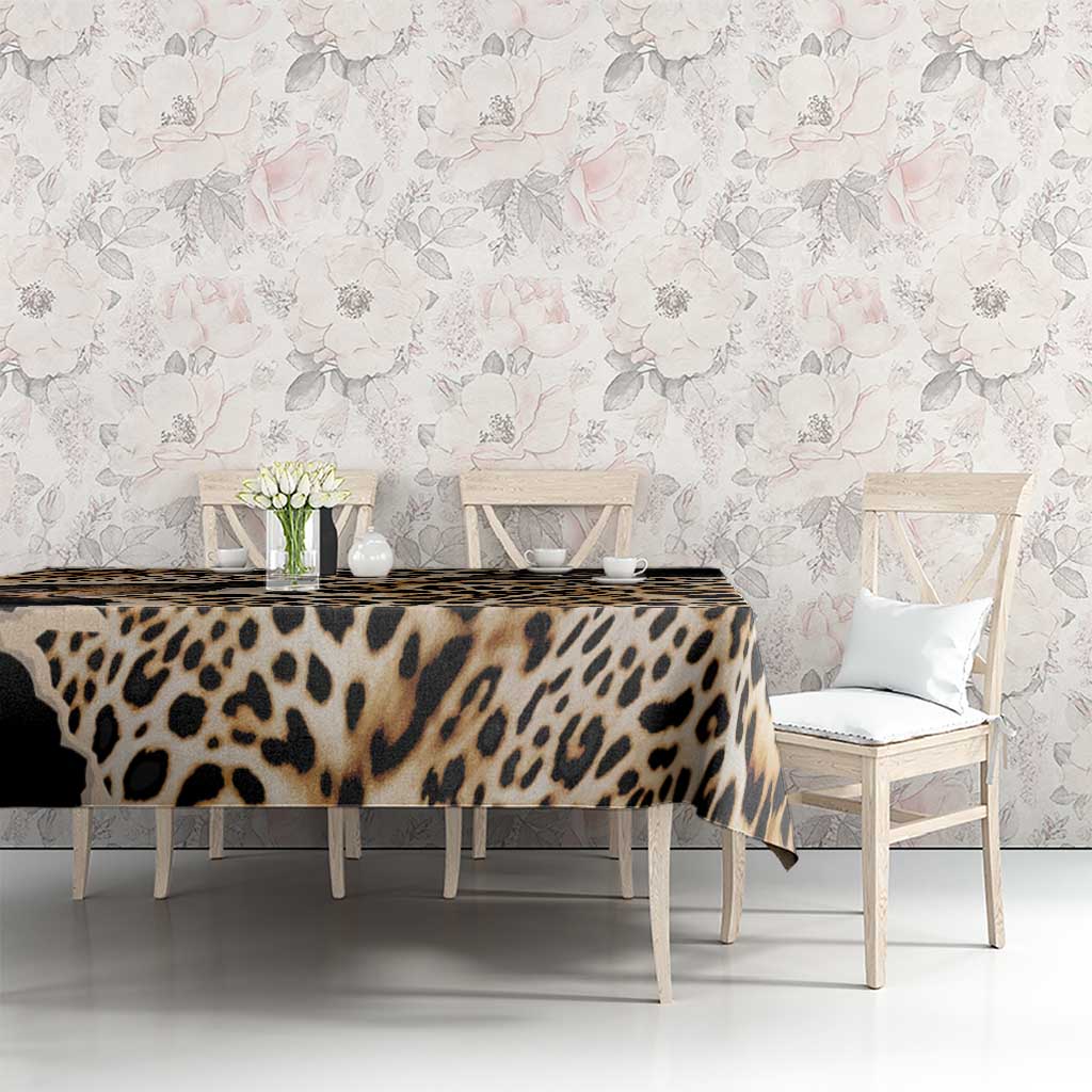 Black and tan leopard-print tablecloth on dining table with hanging sides