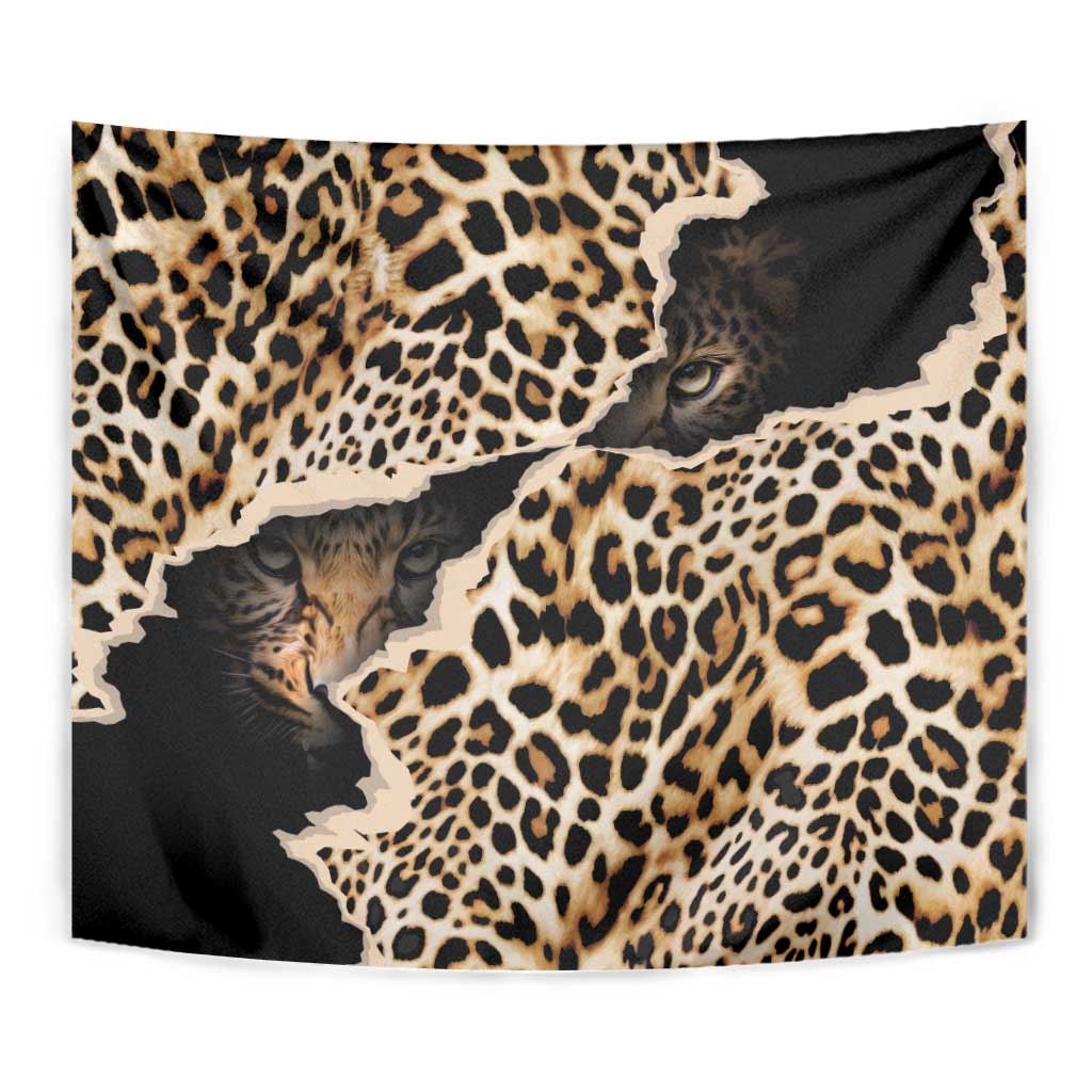 Leopard skin tapestry in black and tan with close-up cat faces and spots