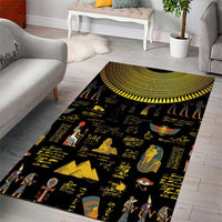 Black area rug with yellow Egyptian hieroglyphs and figures, semicircle medallion