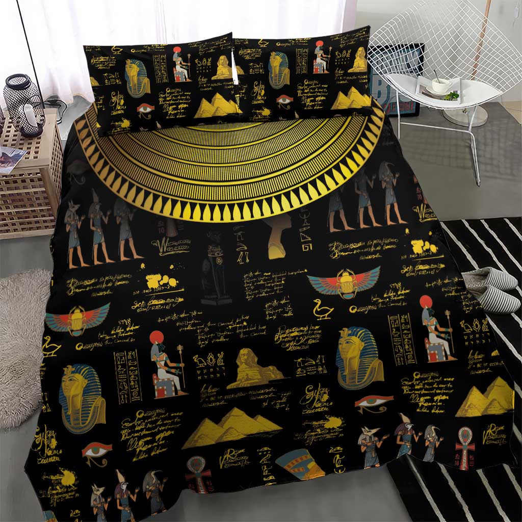 Black bedding set with gold Egyptian hieroglyph and pharaoh prints, duvet centered with pillow