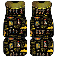 Four black car floor mats with yellow Ancient Egypt hieroglyph and figure artwork