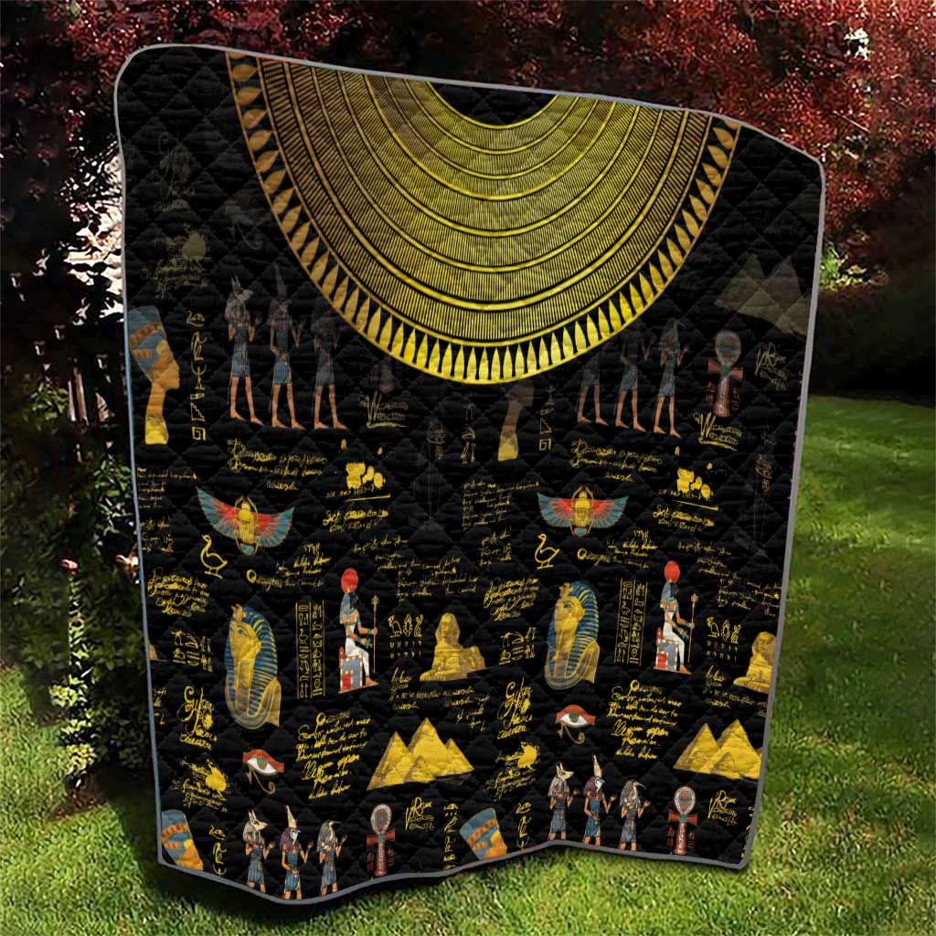 Black Egyptian-themed quilt featuring gold crescent arch and hieroglyph character icons