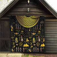 Black quilt hanging indoors with gold crescent arch and colorful Egyptian motifs