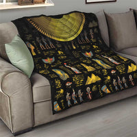Black Egyptian-themed quilt draped over sofa with gold crescent arch and icons